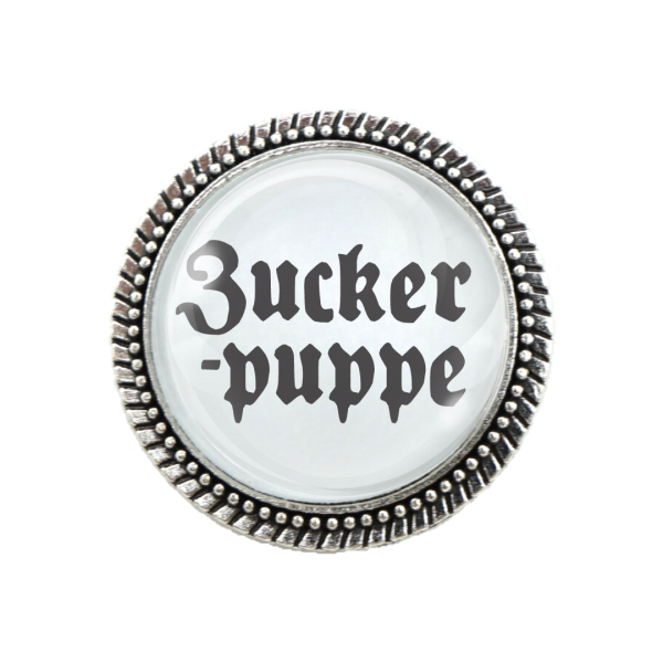 Gaudibrosche in Silber mit dem Spruch "Zuckerpuppe"