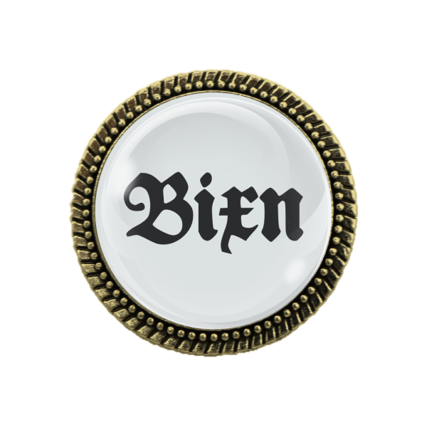 "Freche Trachtenbrosche Bixn in Bronze mit Sicherheitsnadel und Glaslinse"
