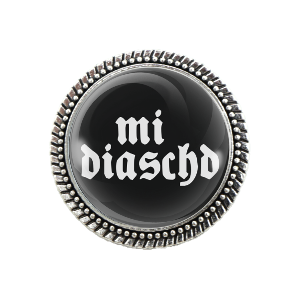 Trachtenbrosche „mi diaschd“ mit silberner Fassung – Vorderansicht